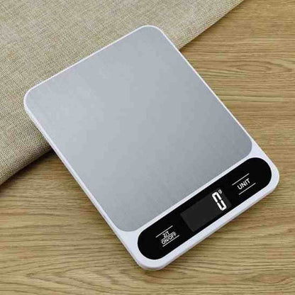 Vue de dessus d'une balance de cuisine Precision Elegance affichant 0g avec boutons tactiles Unit et On/Off sur fond de bois.