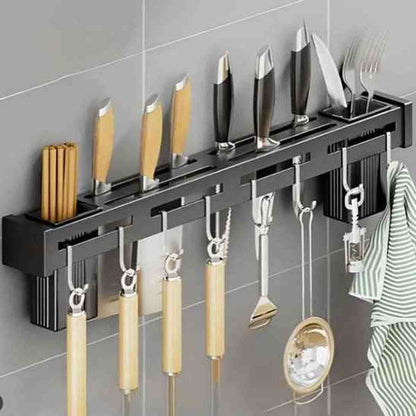 Vue latérale d'un porte-couteaux magnétique noir avec fentes de rangement supérieures et crochets amovibles pour ustensiles.
